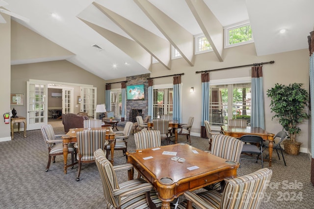 15 Westfield Way, Candler, NC 28715 - dining space featuring carpet floors, french doors, high vaulted ceiling, a fireplace, and a ceiling fan