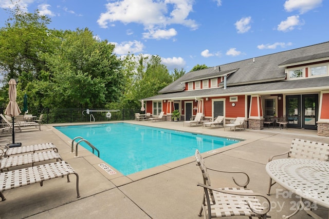 view of swimming pool with a patio