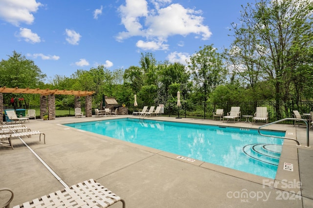 view of swimming pool with a patio area