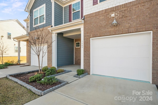 doorway to property featuring a garage