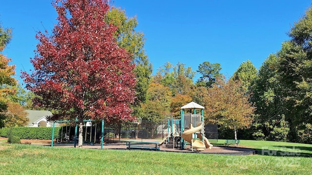 view of jungle gym featuring a yard