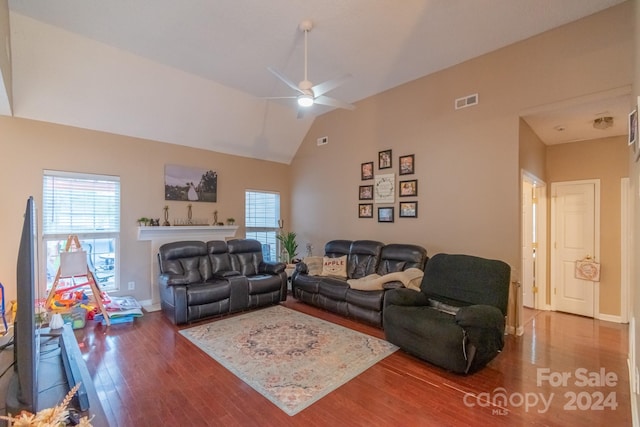 living room featuring ceiling fan, lofted ceiling, and hardwood / wood-style flooring