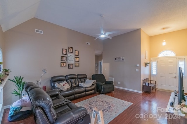 living room featuring ceiling fan, dark hardwood / wood-style flooring, and lofted ceiling