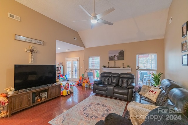 living room featuring ceiling fan, french doors, high vaulted ceiling, and wood-type flooring