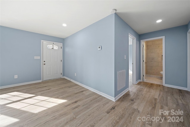 entryway with light hardwood / wood-style flooring