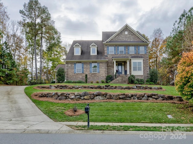 craftsman inspired home with a front lawn