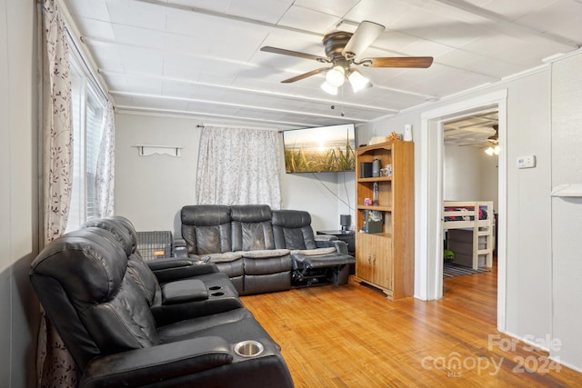 living room with hardwood / wood-style floors and ceiling fan