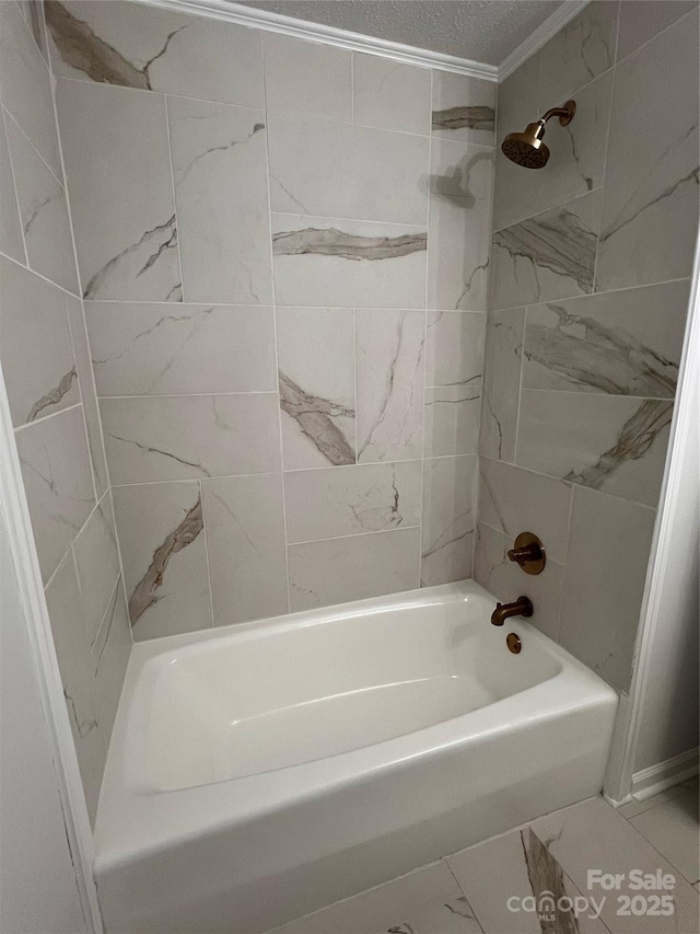bathroom featuring shower / bath combination, ornamental molding, and marble finish floor