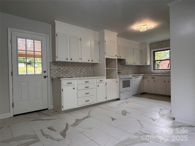 kitchen with baseboards, backsplash, white appliances, and marble finish floor