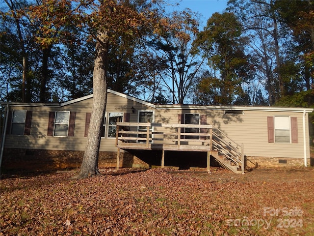 back of property with a deck