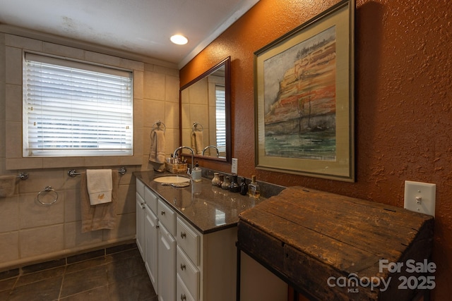 bathroom featuring tile patterned floors, vanity, and crown molding