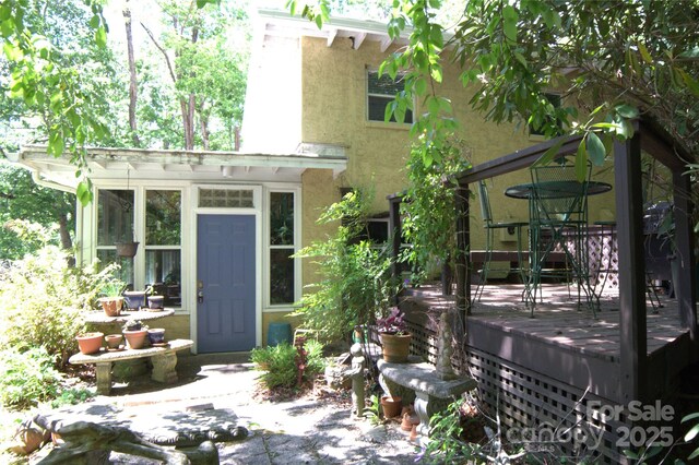 26 Kitazuma Rd, Black Mountain, NC 28711 - entrance to property featuring stucco siding and a wooden deck