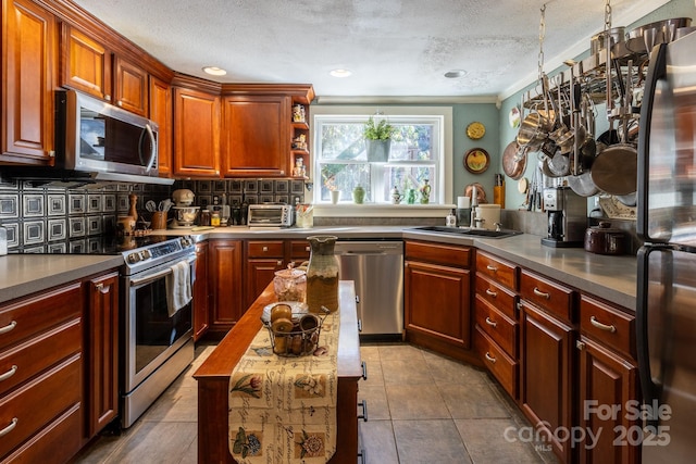 26 Kitazuma Rd, Black Mountain, NC 28711 - kitchen featuring appliances with stainless steel finishes, a sink, a textured ceiling, backsplash, and open shelves