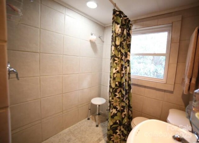 26 Kitazuma Rd, Black Mountain, NC 28711 - full bath featuring a tile shower, toilet, a sink, tile walls, and ornamental molding