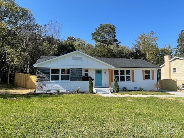 ranch-style home with a front yard