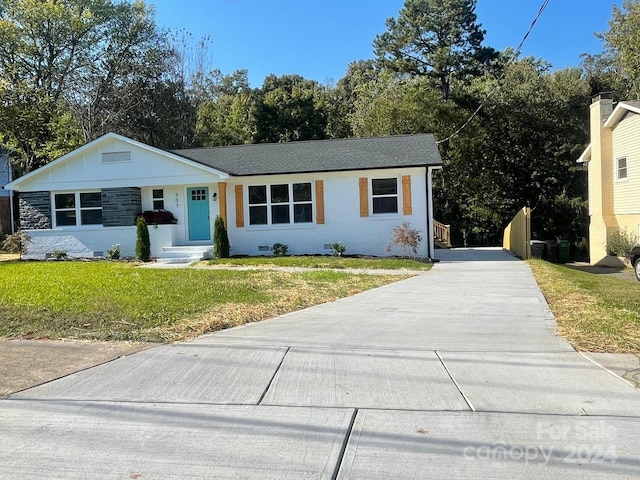 ranch-style home with a front yard