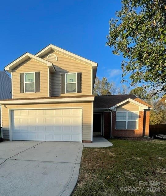 front of property with a garage