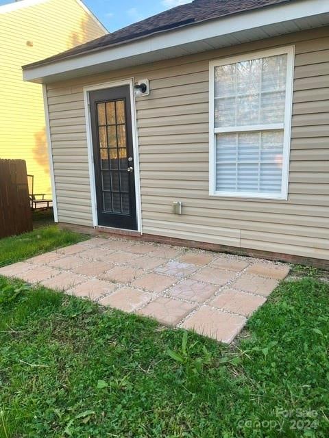 doorway to property with a patio area