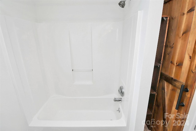 bathroom with shower / bathing tub combination