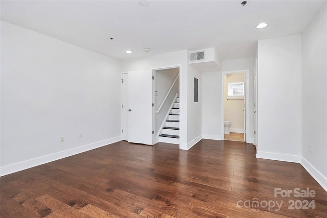 empty room featuring dark wood-type flooring