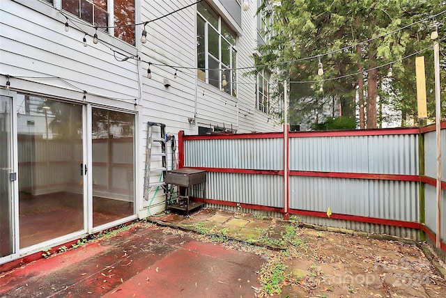 view of property exterior with a patio area