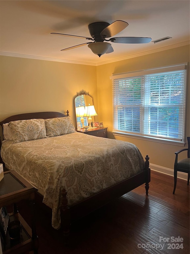 bedroom with hardwood / wood-style flooring, ceiling fan, and crown molding