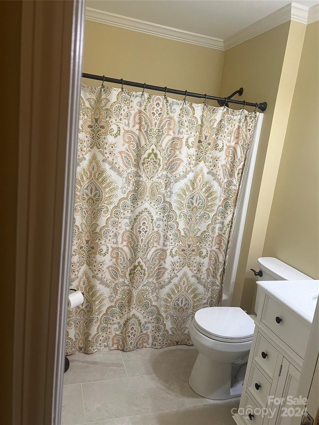 bathroom featuring vanity, tile patterned flooring, toilet, and crown molding