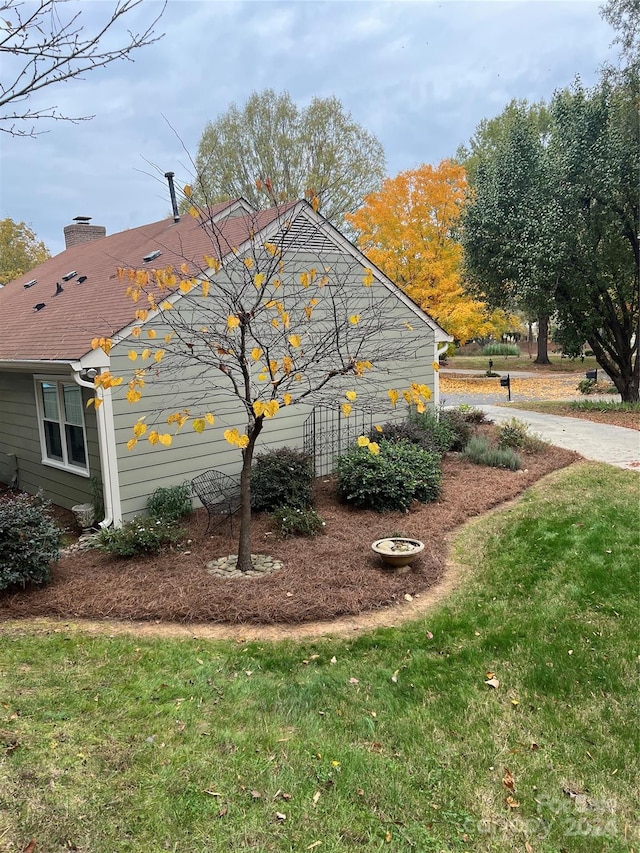 view of home's exterior featuring a lawn