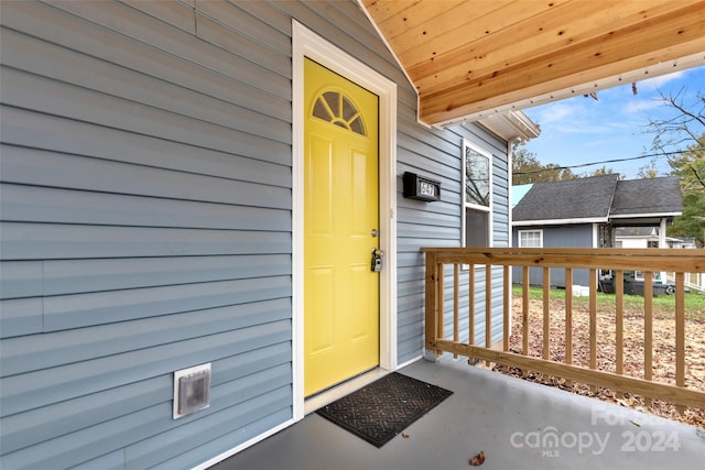 doorway to property with a porch