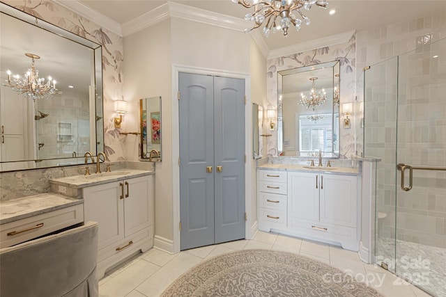 bathroom with a chandelier, crown molding, and a sink