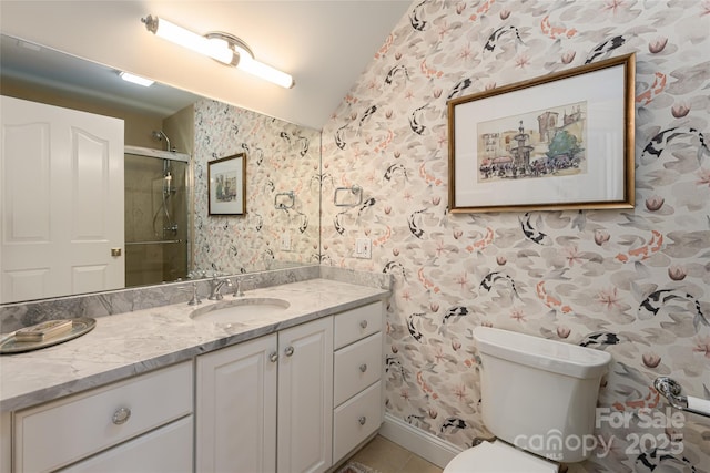 bathroom with toilet, vanity, a shower stall, tile patterned floors, and wallpapered walls