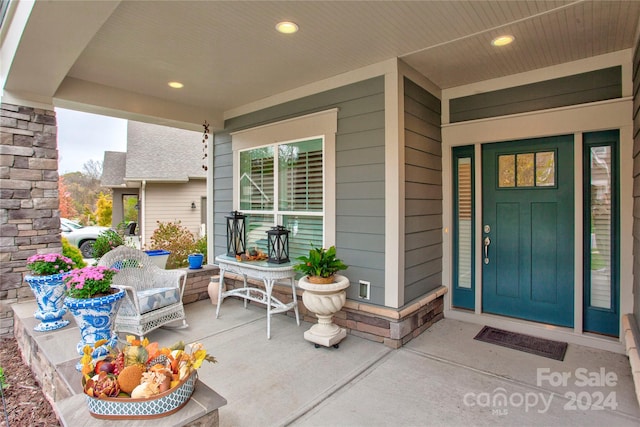 doorway to property with a porch