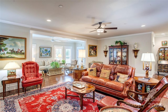 living room featuring ceiling fan, hardwood / wood-style floors, and ornamental molding