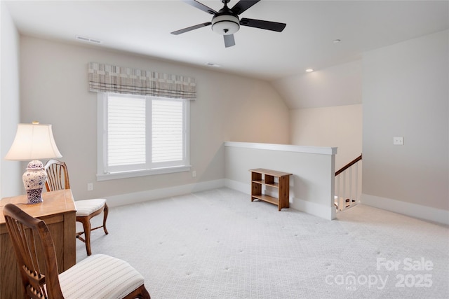 sitting room featuring an upstairs landing, a ceiling fan, carpet, baseboards, and lofted ceiling