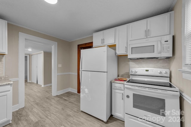 kitchen featuring white cabinets, light wood-type flooring, white appliances, and ornamental molding