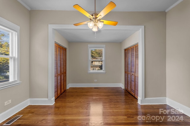 foyer with wood-type flooring, plenty of natural light, and ceiling fan