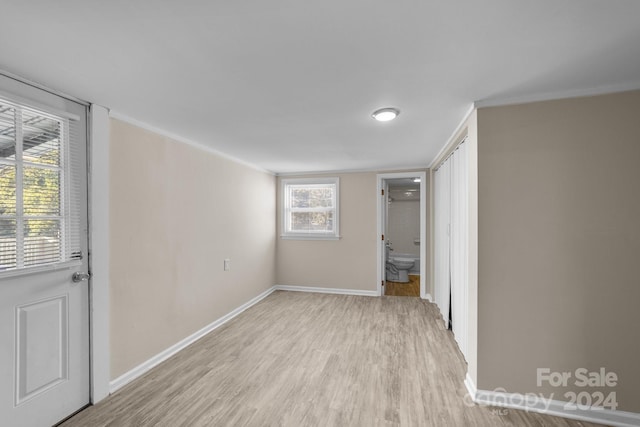 spare room featuring light hardwood / wood-style flooring