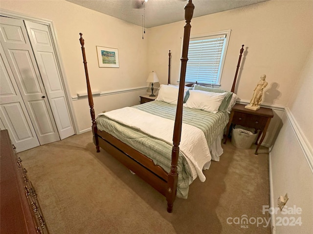 carpeted bedroom with a closet