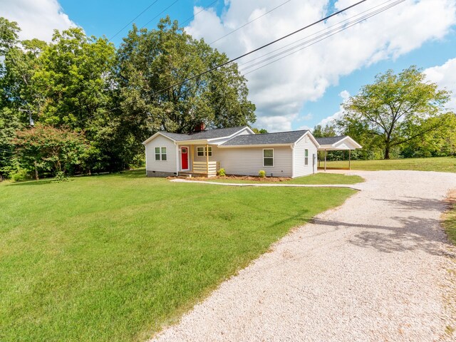 single story home featuring a front yard