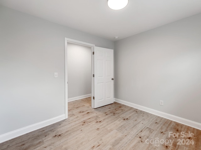 unfurnished room featuring light hardwood / wood-style floors