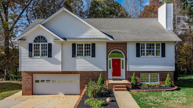 split foyer home featuring a garage