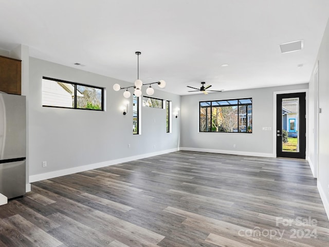 interior space with dark wood-type flooring and ceiling fan