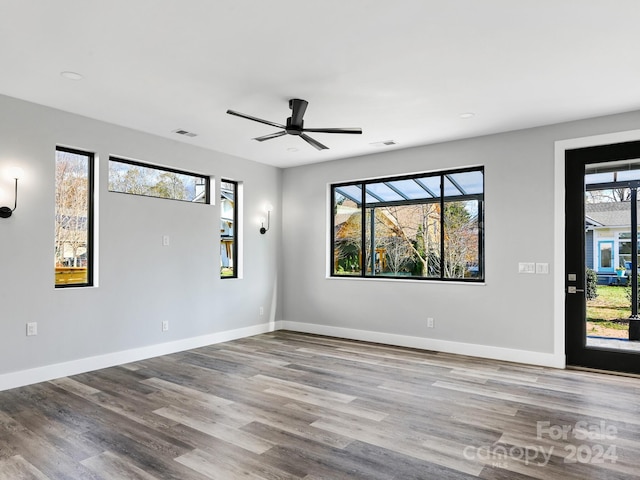 empty room featuring ceiling fan and light wood-type flooring