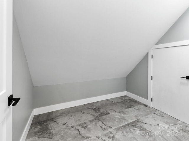 bonus room featuring vaulted ceiling