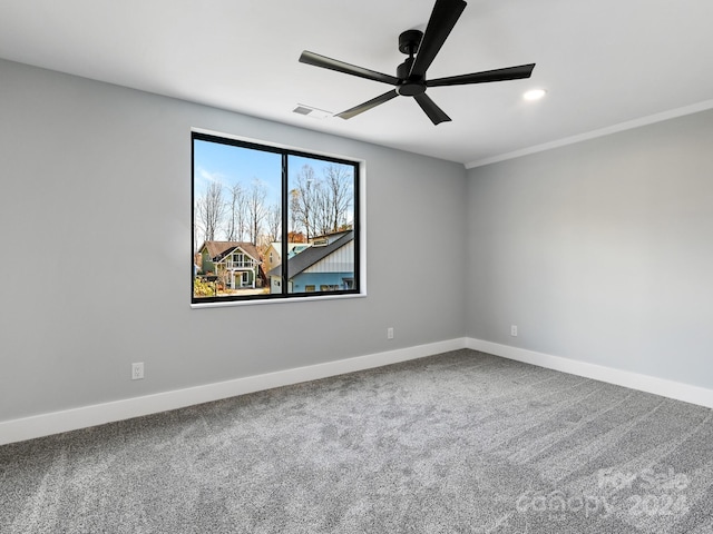 unfurnished room featuring ceiling fan and carpet floors