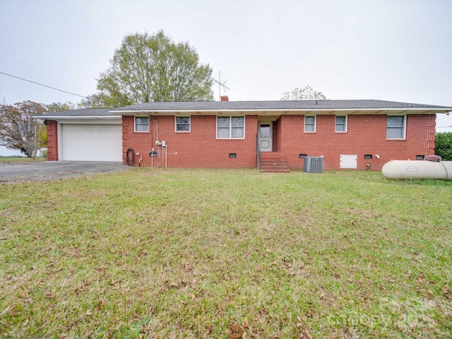 back of house with a garage, central AC unit, and a lawn