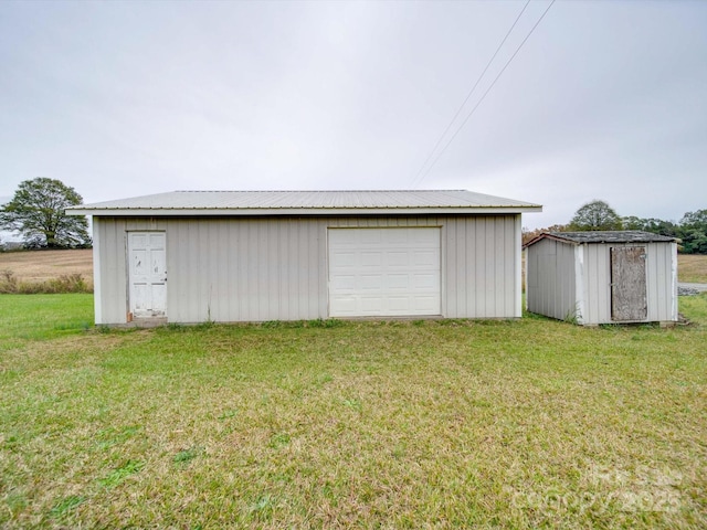 garage with a lawn