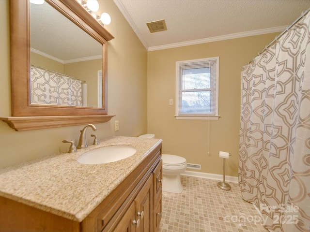 bathroom featuring crown molding, vanity, a textured ceiling, and toilet