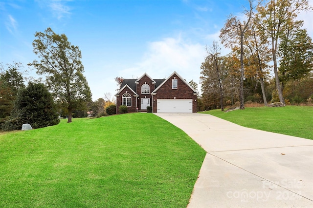 view of front of property with a garage and a front lawn