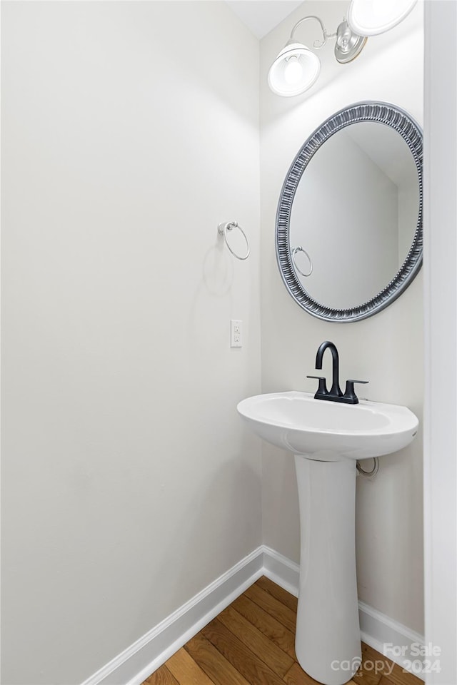 bathroom featuring sink and wood-type flooring